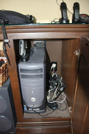 Computer tower cabinet with thermostat-controlled vent to the attic