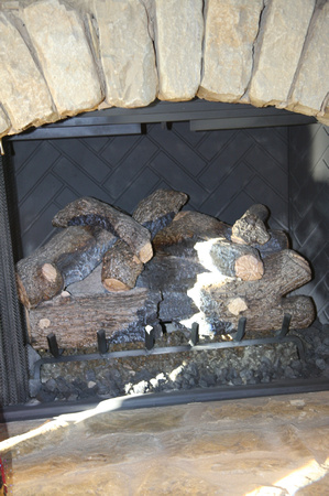 Larg gas log sets inside & out - can be converted to real wood